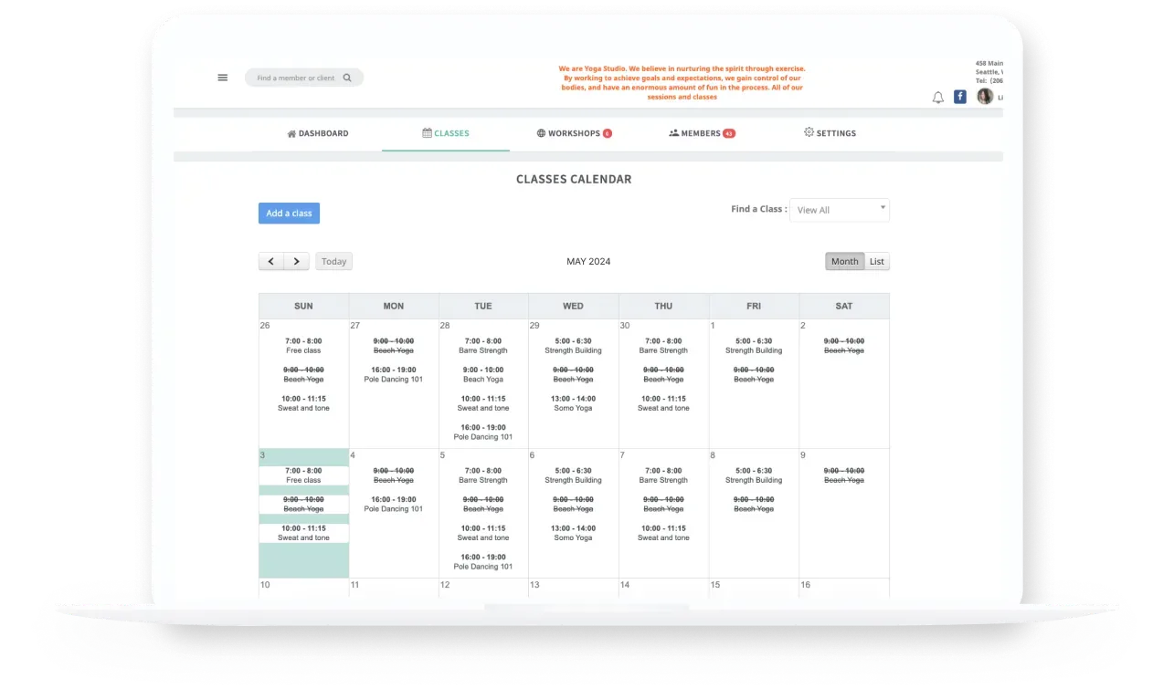 StudioBookings classes calendar on a laptop showing monthly yoga and fitness timetable